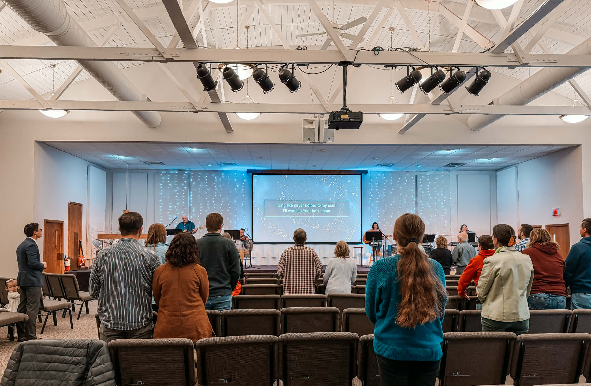 The congregation standing in worship at Medina Community Church